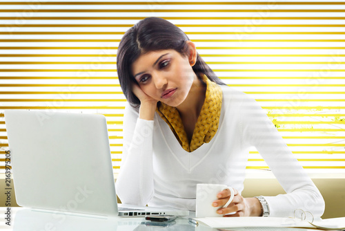 Businesswoman getting bored in an office 