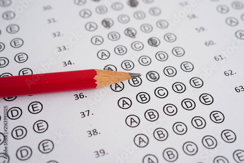 Answer sheets with pencil drawing fill to select choice, education concept.