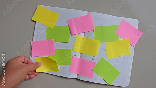 Multiple sheets sticky notes on notebook. brainstorm, planning concept.