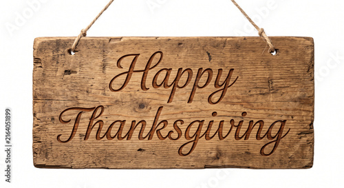 Happy Thanksgiving message carved into a rustic wooden sign hanging by rope against a clean white background with copy space
