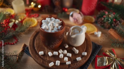 hot tasty cocoa cup with marshmallow on wooden table at christmas holiday, warm delicious cacao mug with sweets on wood board at new year eve