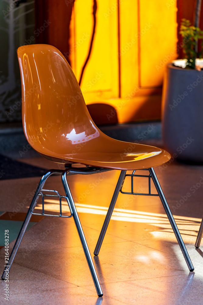 Fototapeta premium Modern Transparent Chairs in Warm Sunlight