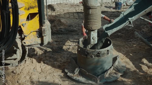 pile driver heavy machinery for concrete work at construction site, industrial piling machine for foundation building 4k