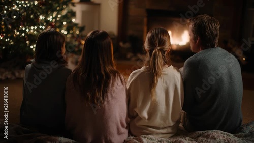 Family Cozy Evening By Warm Fireplace And Christmas Tree
