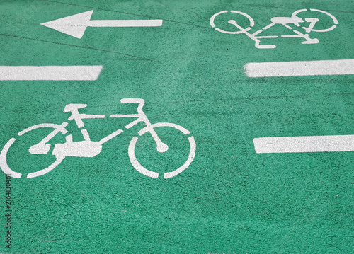 Green two-way bicycle lane markings on asphalt surface. In Romania