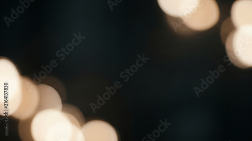 Soft white bokeh light dots on black transparent background for elegant design overlays