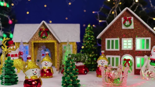 Beautiful decorated Christmas town on a dark blue background with flashing lights