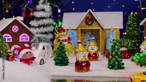 A beautiful Christmas town with a yellow car in the foreground