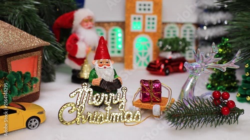 A gnome with letters against the background of the Santa Claus chapel