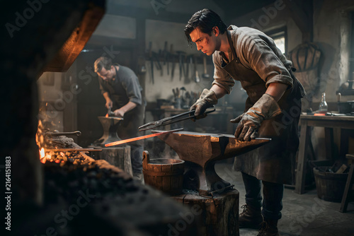 A blacksmith working in a traditional stone forge with a glowing hot metal piece on an anvil and a furnace in the background