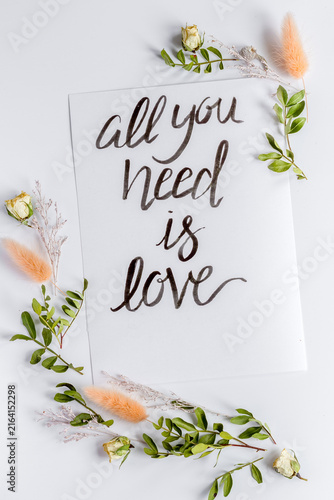 calligraphy floral pattern top view all you need is love