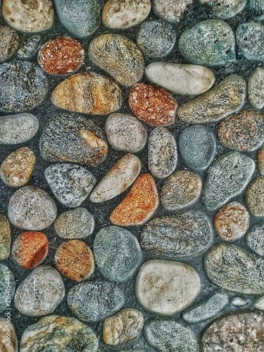 Photography This photo shows small pebbles in various shapes and sizes.