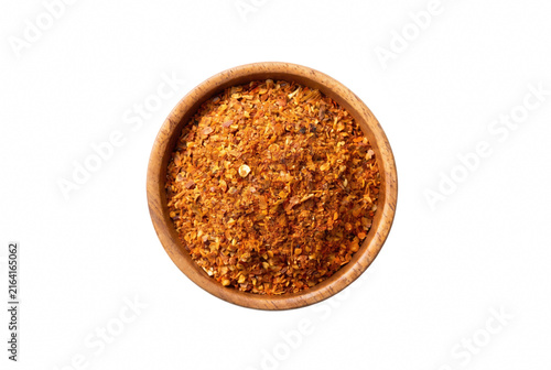Konstfotografi Top down view of red chili flakes and spice mix in a small wooden bowl