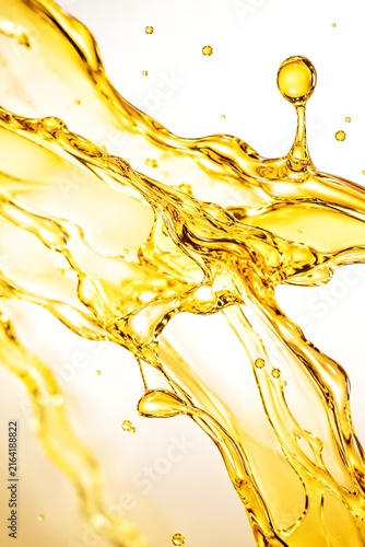 Flowing golden olive oil splash creating abstract fluid motion macro