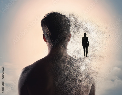 Silhouette of Man Breaking Into Shards with Light and Abstract Effect