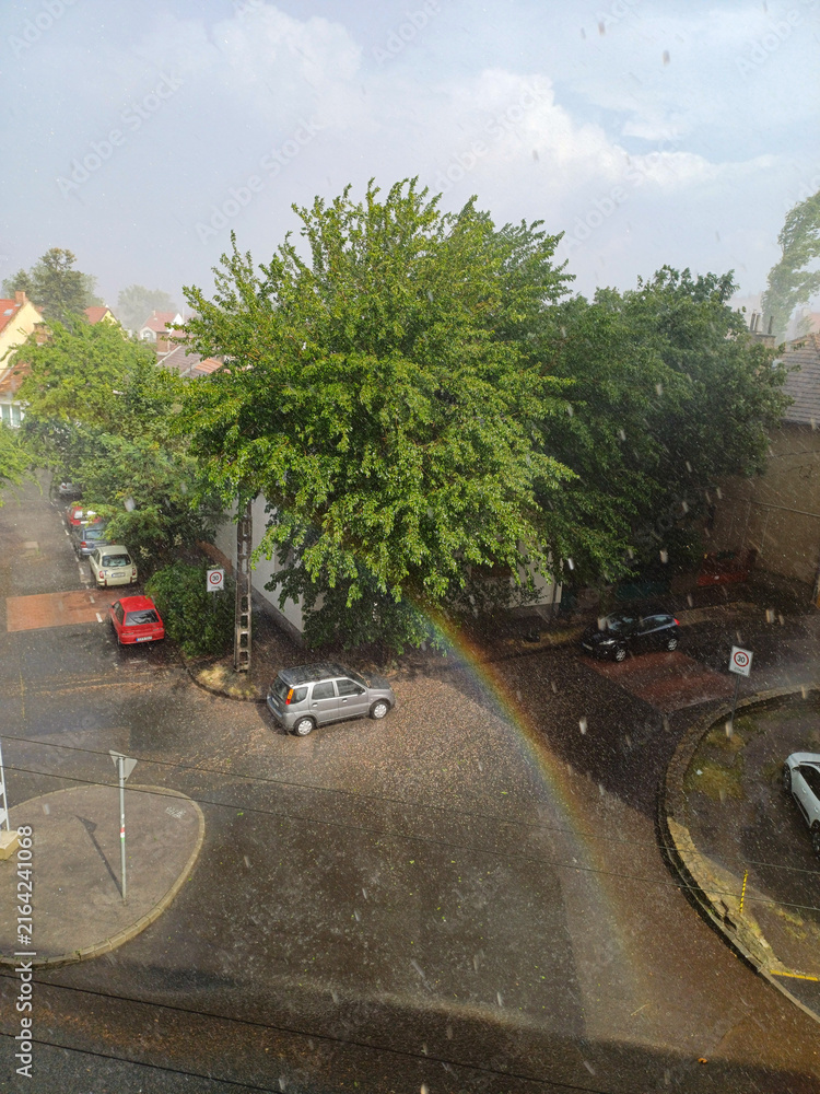 Fototapeta premium Rainbow Over Wet City Street