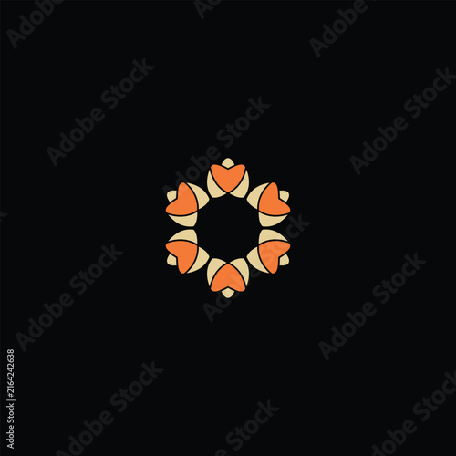 Decorative circular logo composed of stylized orange and cream petal shapes arranged around a dark central space. The symmetrical floral emblem conveys harmony, warmth, balance, unity, and natural ele