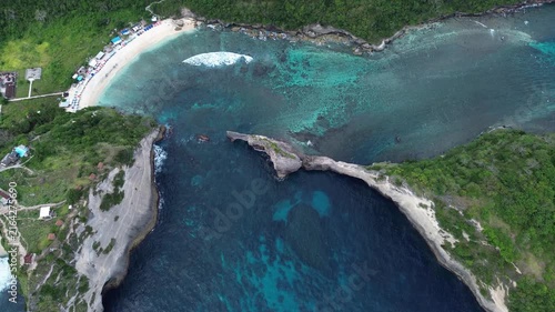 Amazing aerial view of atuh beach and the stunning rock formations on the coast of nusa penida, bali