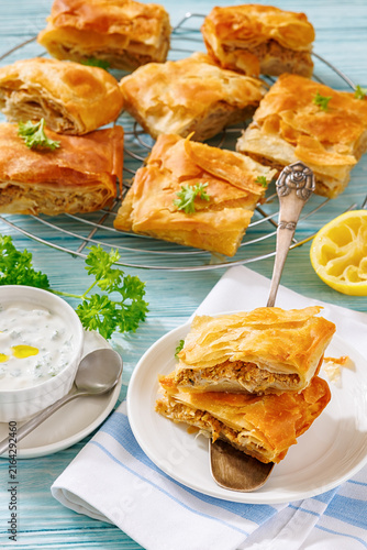 Crispy phyllo ground meat pie cut into squares