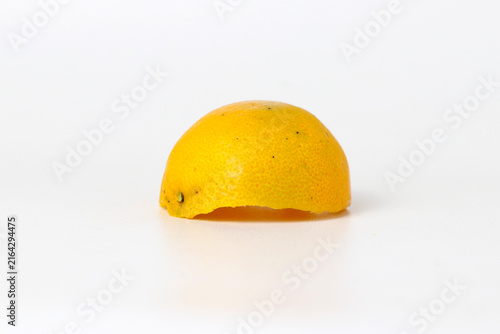 Orange peel sitting on a white isolated background.