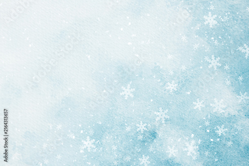 A blue watercolor background with falling snow for designing winter holiday web banners