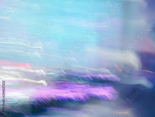Foto Abstract long exposure intentional camera movement photography background with neon glowing light trails in blue, purple and pink tones