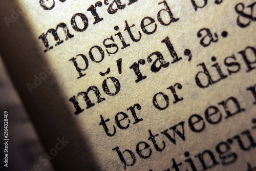Konstfotografi Word moral printed on dictionary page, macro close up