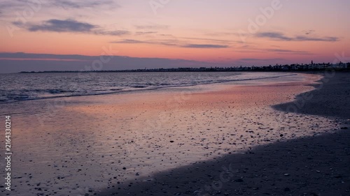 Sunrise view over Golden Mile beach as gentle waves roll out, Britannia Bay