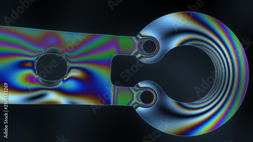 Photoelastic Stress Fringes Sweeping Across a Transparent Loaded Part Under a Dark-Field Polariscope, Seamless Loop in vibrant blue tones