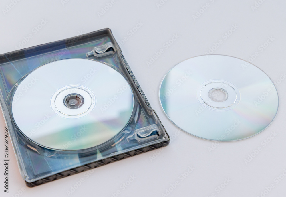 Fototapeta premium Two Blank Compact Discs and Open Case on White Background