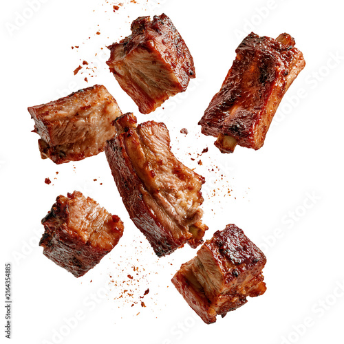 Juicy barbecue ribs pieces on a white background ready for serving at a summer gathering or barbecue party