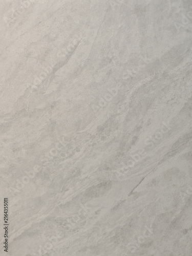 a smooth light grey slate stone surface featuring faint natural veins and subtle granular detail. Ideal for modern interior architecture design, kitchen countertop mockups, 