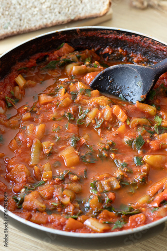 Tomato pepper sauce in a cooking pan.