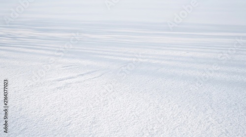Empty snowy desert landscape under cloudy sky