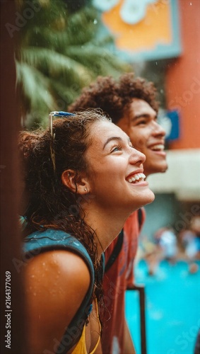 Couple Smiling During Tropical Rain Shower