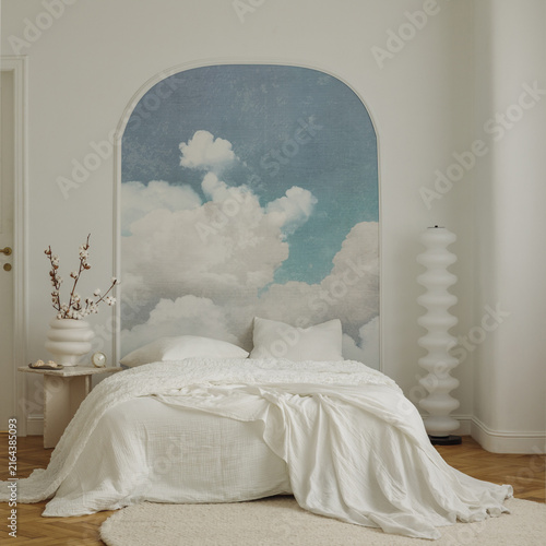 Modern minimalist bedroom interior with sky mural wallpaper, white bed linen, arch design wall, cozy decor, and serene dreamy aesthetic atmosphere