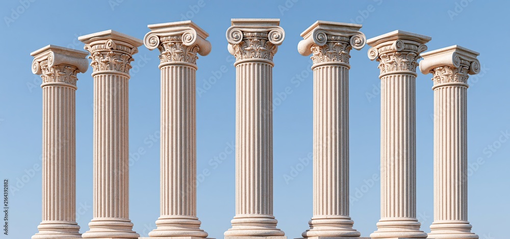 Fototapeta premium In bright daylight, traditional Greek columns with detailed carvings stand against a simple backdrop, highlighting cultural heritage.