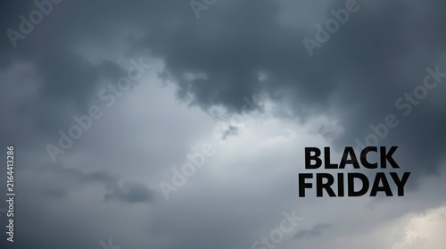 Black Friday text on stormy sky. Dramatic weather background for seasonal retail sales.