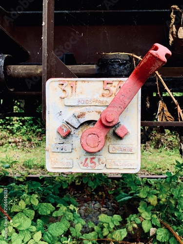 Vintage Red Brake Lever Mechanism on Old Train Wagon with French Lettering