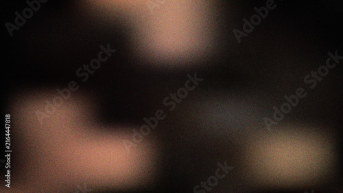 Foto Abstract blurry dark background with warm light bokeh effects creating a soft gr