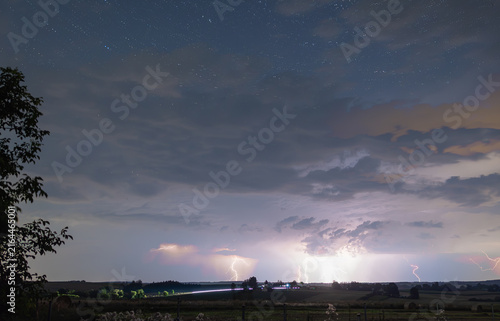 Numerous atmospheric landings in the dark cloudy sky at night, a powerful storm