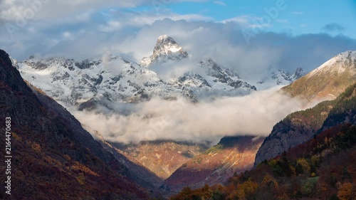Timelapse of clouds drifting around Olan peak at sunset above the Valgaudemar Valley in autumn. Ecrins National Park in Hautes-Alpes, French Alps, France