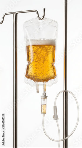 IV drip bag filled with golden beer liquid hanging on a stand isolated on white background, conceptual image representing alcohol addiction, dependency, cirrhosis and health risk