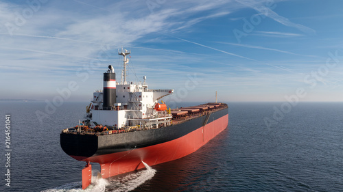 Massive bulk carrier ship Sailing in the Open Ocean, Industrial Freighter for Maritime Shipping, Logistics, Trade, and Transportation