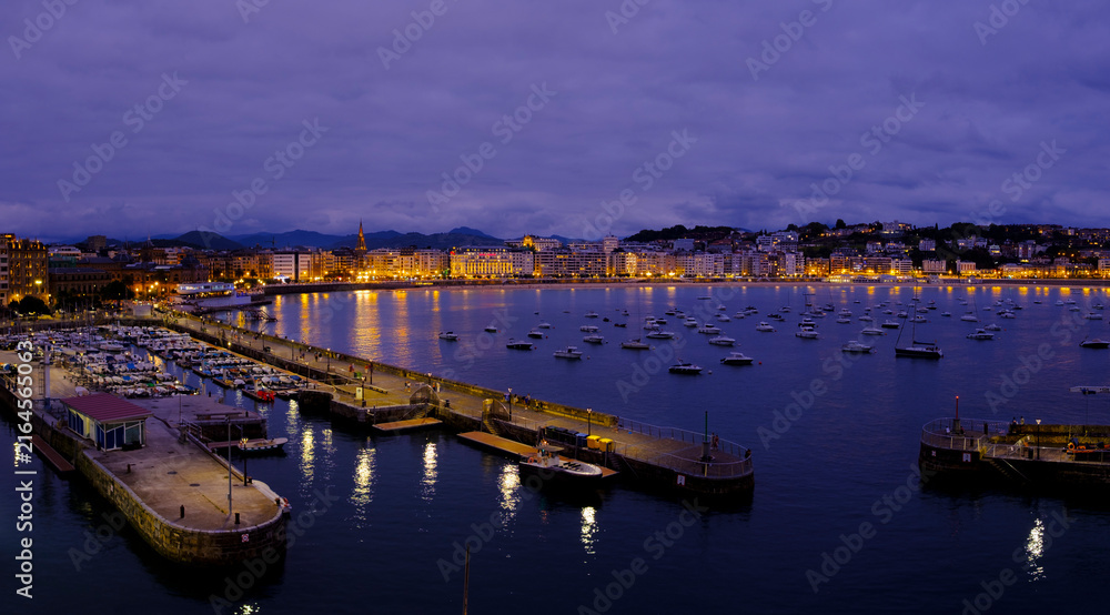 Fototapeta premium La Concha Bay and Harbor in San Sebastian at Night, Basque Country, Spain