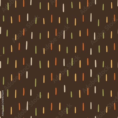 Seamless abstract autumn pattern with simple hand drawn dashes in orange, mustard, olive and cream on a dark brown background. Minimal geometric fall design.