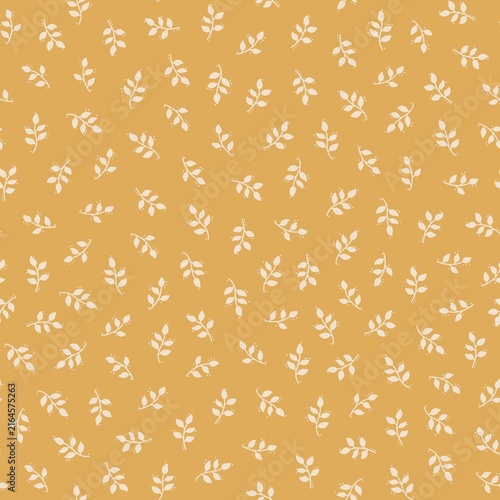 Seamless autumn botanical pattern with small cream leafy branches on a warm mustard yellow background. Simple hand drawn foliage design with a cozy seasonal look.