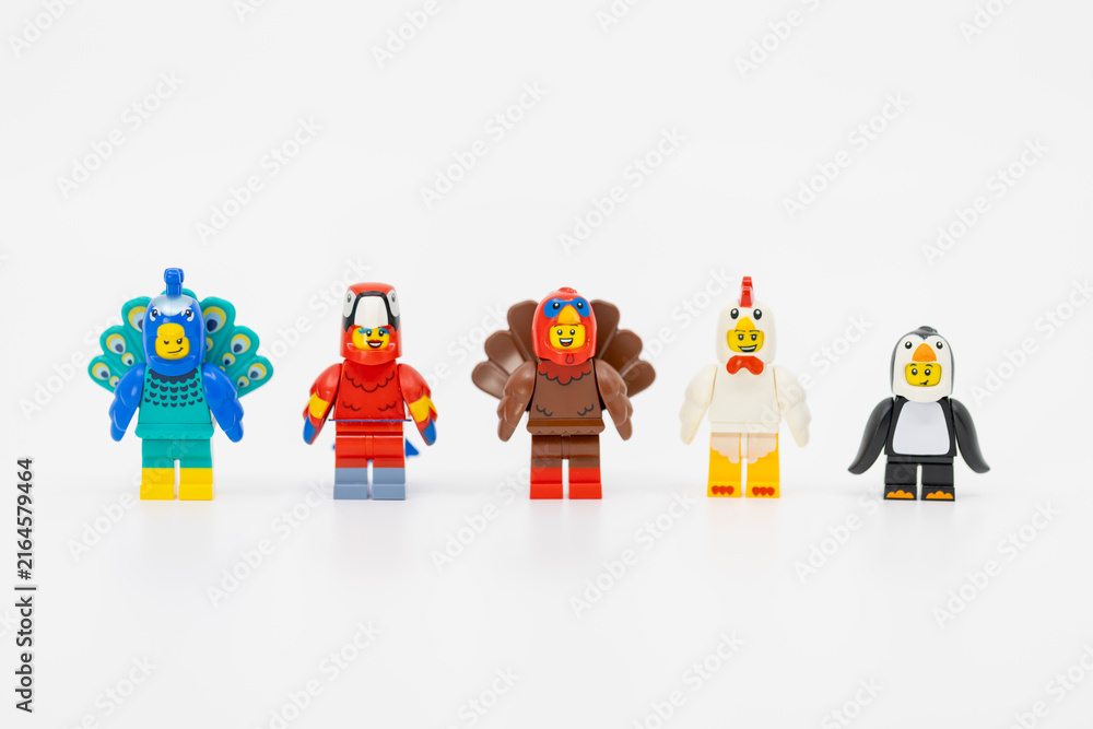 Fototapeta premium Hong Kong, June 8, 2026: Five cute minifigures wear animal bird suits of peacock, parrot, turkey, chicken, and penguin.