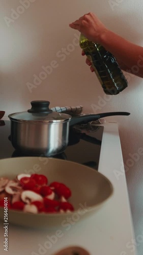Woman Prepares a Healthy Meal in Her Home Kitchen