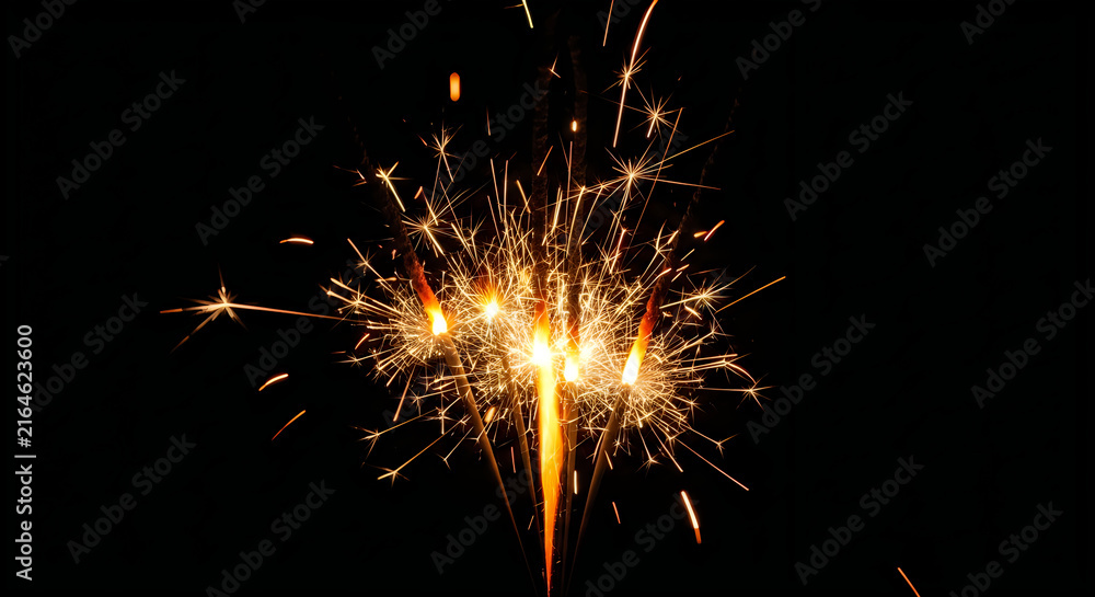 Fototapeta premium Bright golden sparks from a burning firework celebrating the traditional indian festival of diwali